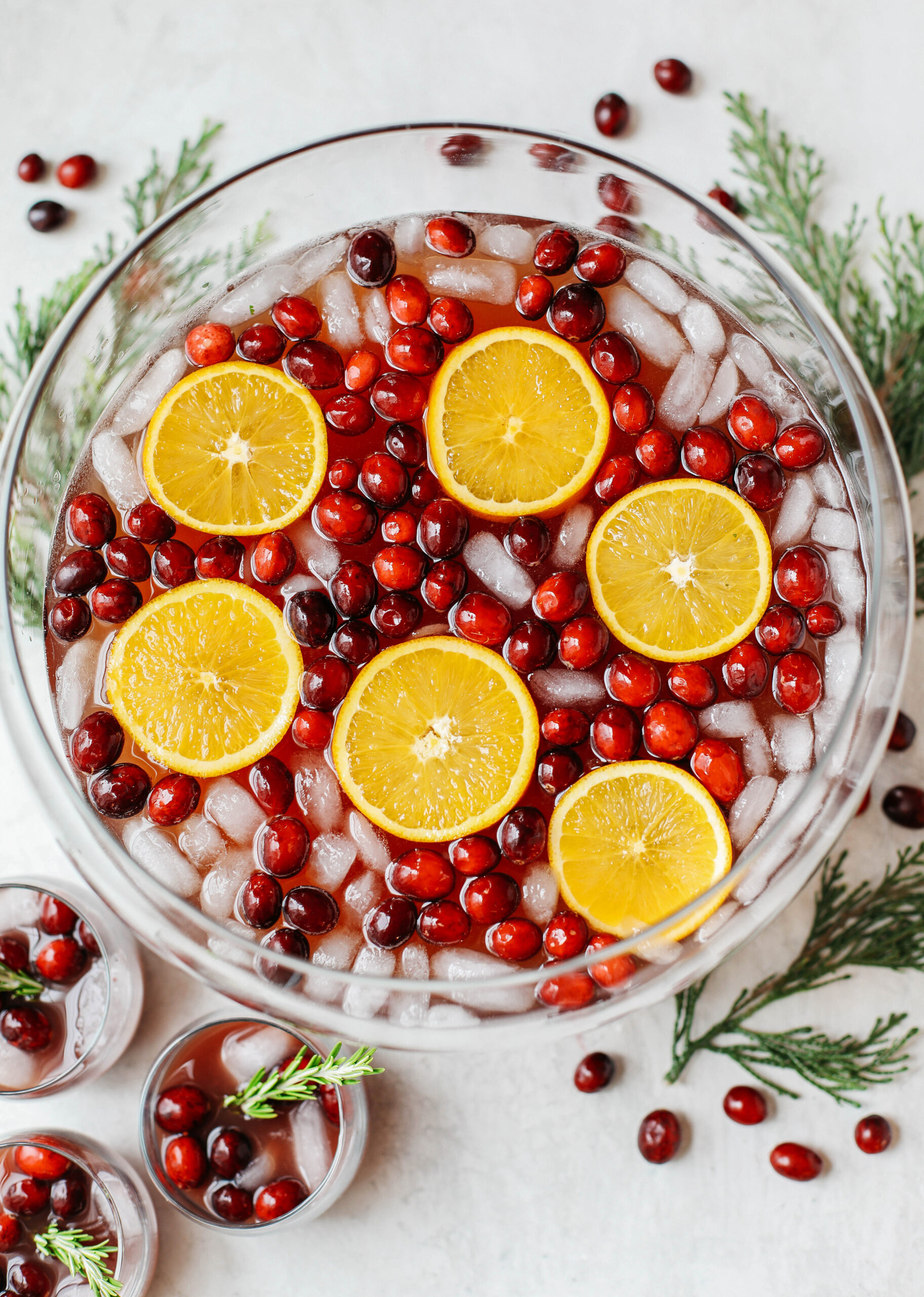 This Sparkling Christmas Punch makes the perfect addition to any holiday party or gathering with a delicious blend of cranberries and oranges all marinated together in one festive cocktail!